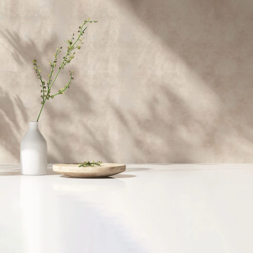 Geometric 3D-printed planter with a small plant on a minimal background